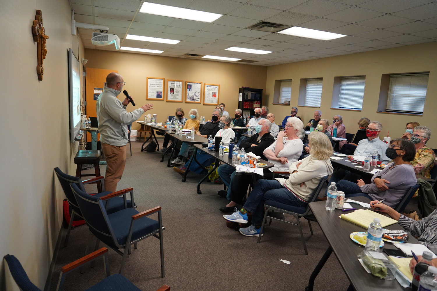 Dan Lester, executive director of Catholic Charities of Central and Northern Missouri, addresses volunteers during an orientation session for community sponsorship of refugees.